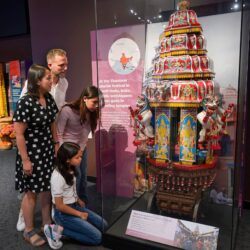 A Person Standing In Front Of A Store