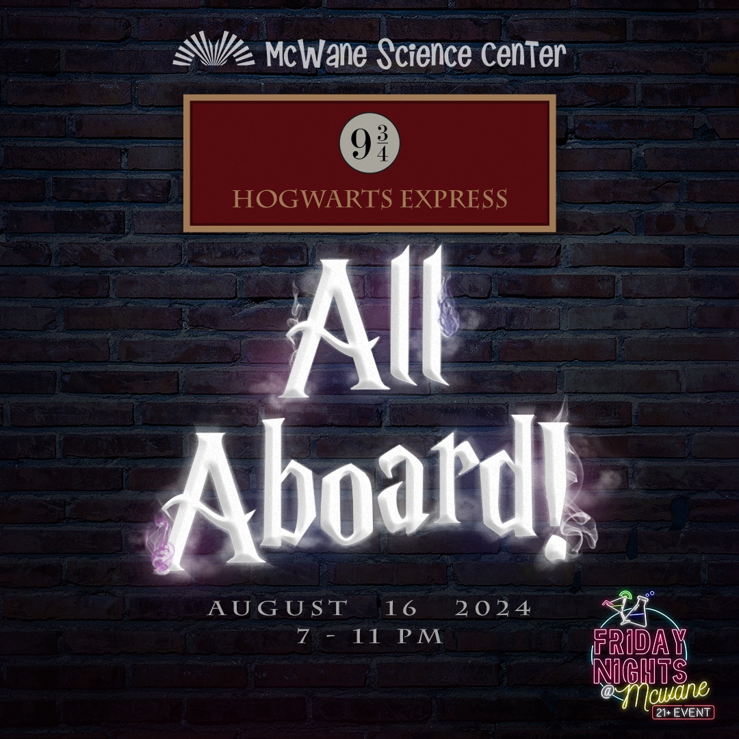 a sign in front of a brick building